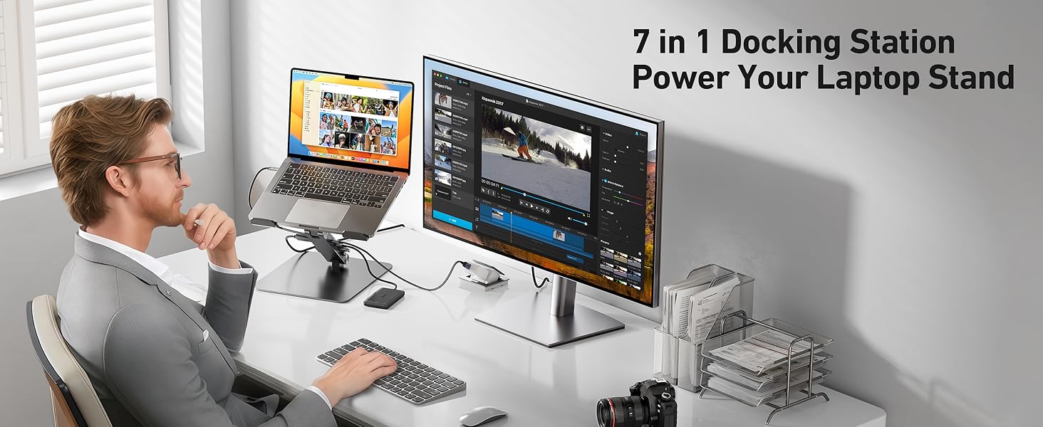 avec fonctions de station d'accueil, compatible avec plusieurs appareils. Personne utilisant un ordinateur portable sur support connecté à un grand écran, à un clavier et à d'autres périphériques sur le bureau